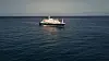 Det nederlandske cruiseskipet MV Hondius ligger for anker på rolig hav utenfor Kapp Verde.